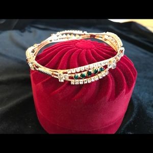 Golden accent with green and red crystals bangles